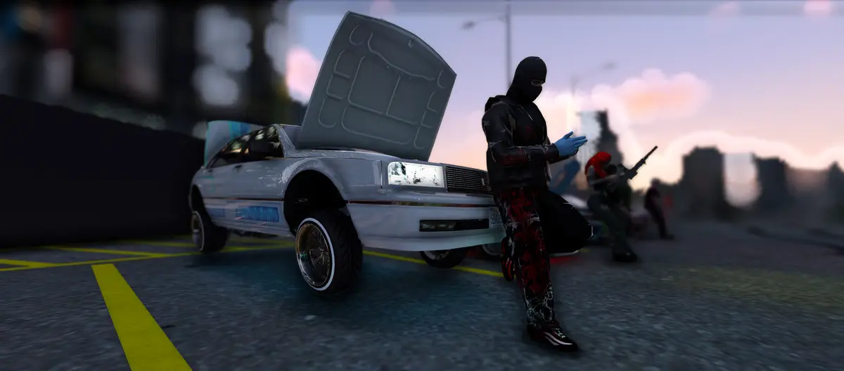 A masked DRILL UK player in red and black checking their phone beside a white lowrider with its bonnet up at dusk